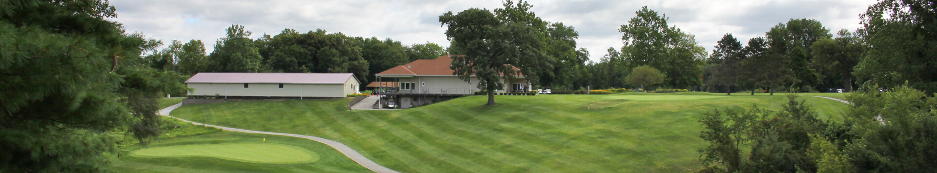 Fairway, green, clubhouse and maintenance garage at Indian Bluff Golf Course
