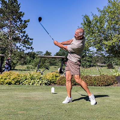 Man driving the ball at Indian Bluff Golf Course